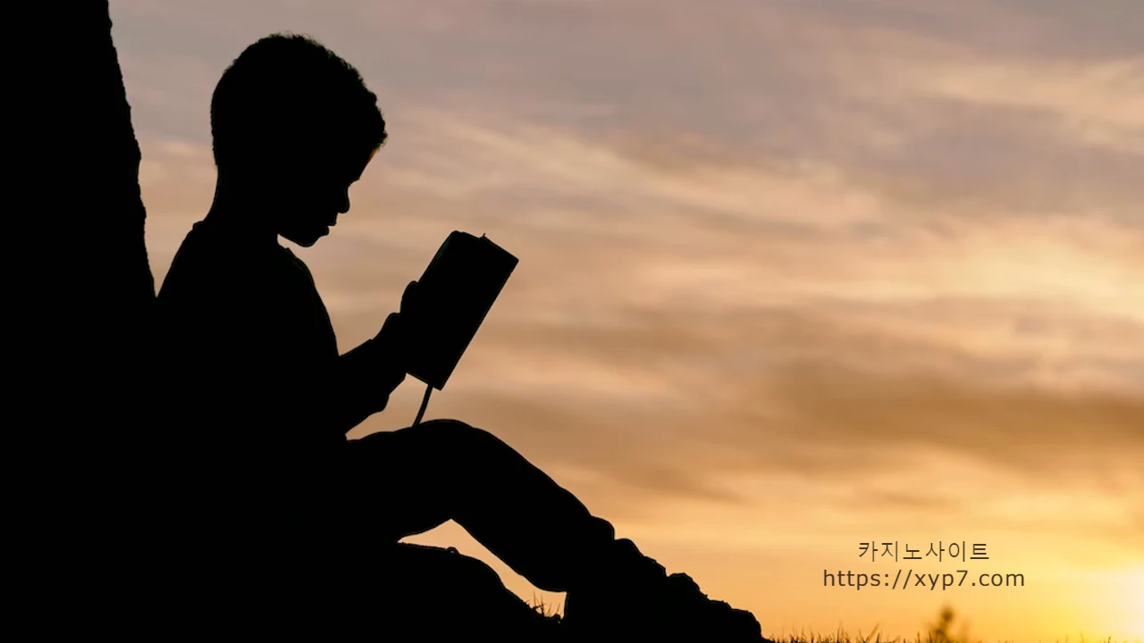 silhoutte of child reading